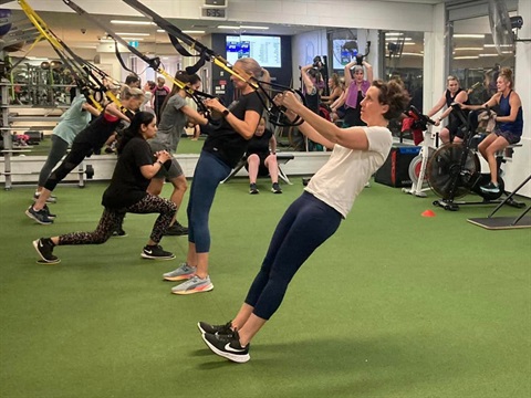 Image of members exercising in a high intensity gym class