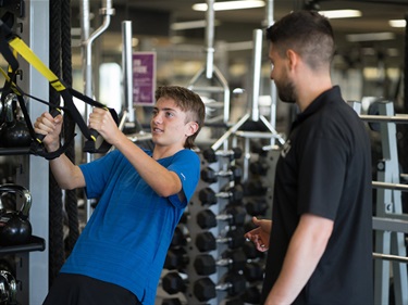 Image of Youth 14 to 17 years performing a strength exercise with Personal Trainer