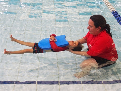 image of child and swim teacher