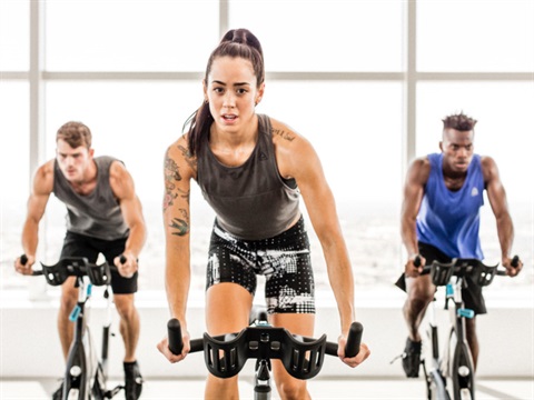 Image of participants on cycle bikes in studio